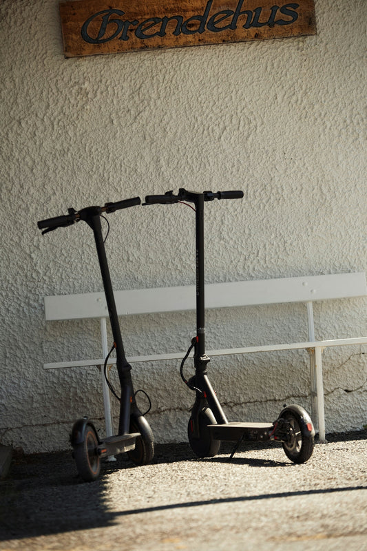 two scooters parked in front of a building