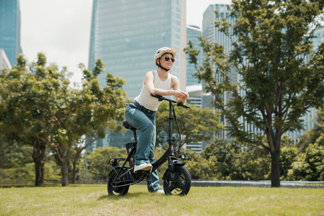 A woman riding an electric scooter in a park