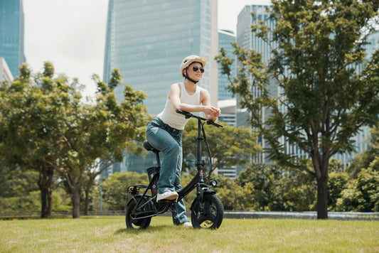 A woman riding an electric scooter in a park